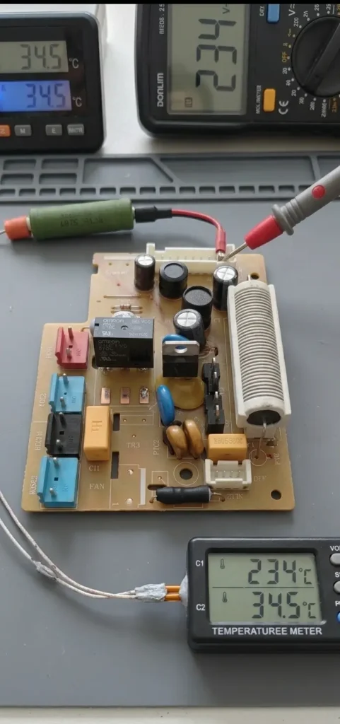 Full load testing setup showing repaired power board with 234V AC output and 34.5°C relay temperature.
