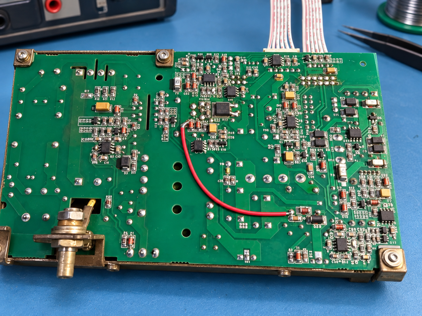 Reconstructed insulated jumper on the PM-8000 power board